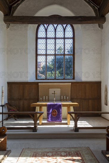 Interior of church view of sanctuary with altar and east window, Metfield, Suffolk, England, UK