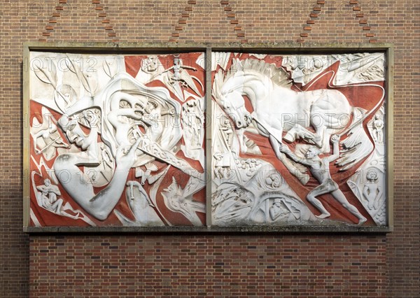 Carved murals sculpture by Walter Ritchie (1919-1997), 'Man's Struggle' 1957, Coventry, England, UK