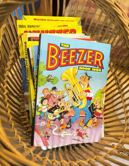 1980s children's cartoon comic annuals the Beezer annual book 1986, inside antiques centre, Marlesford Mill, Suffolk, England, UK