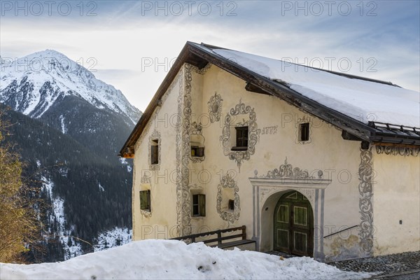 Historic house, sgraffito, facade decorations, mountain peak, snow, winter, Guarda, Engadin, Grisons, Switzerland, Europe