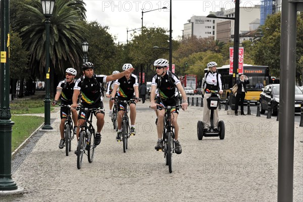 Tourists on a cruise ship during a shore excursion with bicycles and Segway, Praca Marques de Pombal, Lisbon, Lisboa, Portugal, Europe