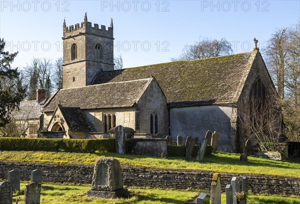 Headstones in graveyard of village parish church of Saint James at Cherhill, Wiltshire, England, UK