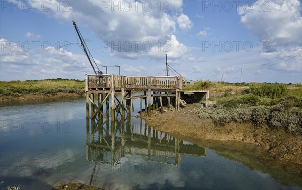 Canal and crane for oyster farming in Saint-Pierre-d'Oleron, Departement Charente-Maritime, Nouvelle-Aquitaine, France, Europe