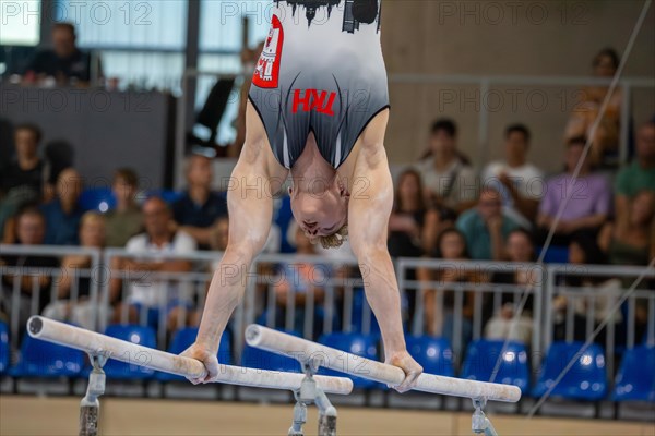 Heidelberg, 9 September 2023: Men's World Cup qualification in conjunction with a national competition against Israel. Glenn Trebing during his routine on parallel bars