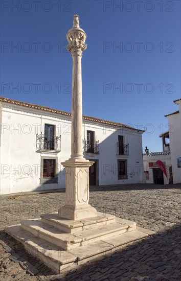 Marble post reputedly used for slave auctions in side historic walled hilltop village of Monsaraz, Alto Alentejo, Portugal, southern Europe, Europe