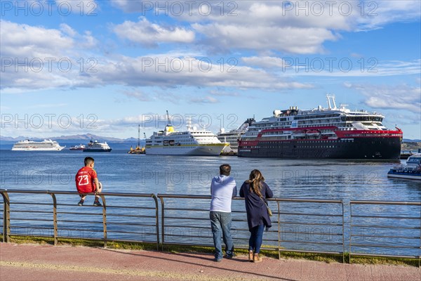 People watching cruise ships in the harbour at the Beagle Channel, Ushuaia, Tierra del Fuego Island, Patagonia, Argentina, South America