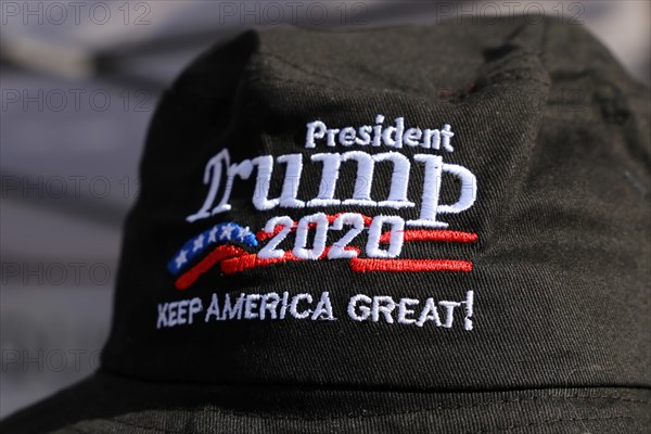 Convinced Trump supporter in Germany wears a cap with the campaign slogan Trump 2020 - keep America great