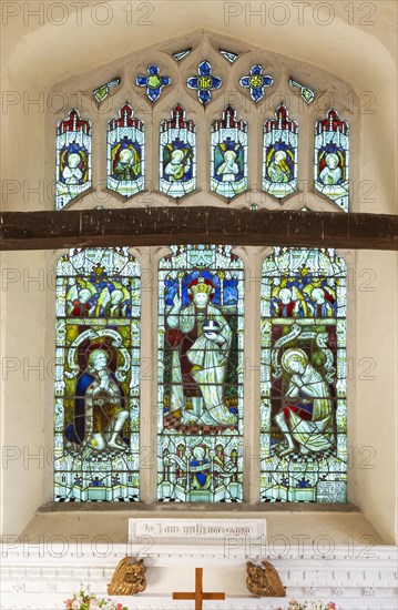 Stained glass east window Christ the King, Hacheston church, Suffolk, England, UK c 1919 war memorial by Kempe and Co