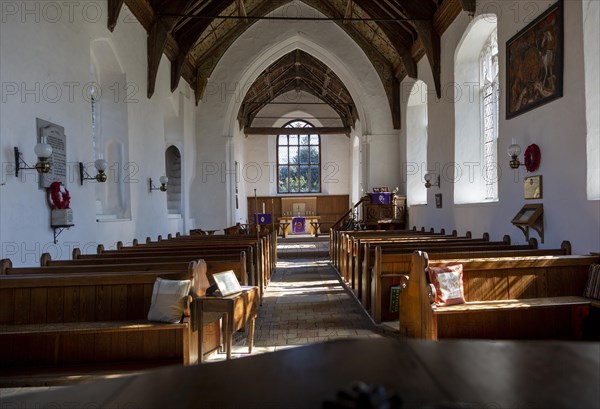 Interior of church view of nave to chancel altar and east window, Metfield, Suffolk, England, Uk