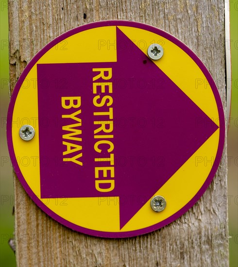 Macro close up of Restricted Byway sign on fencepost, Sutton, Suffolk, UK