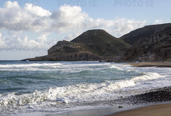 Waves breaking on sandy beach at Las Negras, Cabo de Gata Natural Park, Nijar, Almeria, Spain, Europe