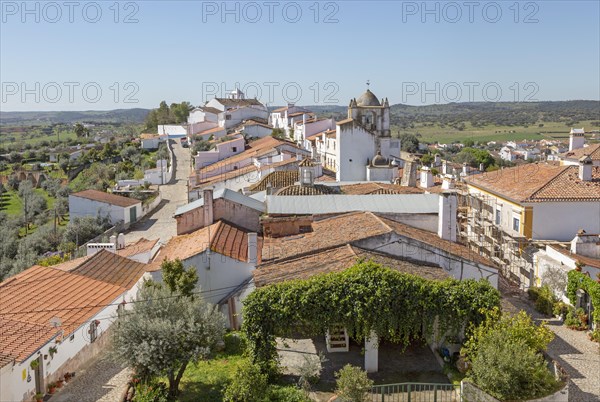 View over rooftops of whitewashed houses and streets in the small rural settlement village of Terena, Alentejo Central, Portugal, Southern Europe, Europe