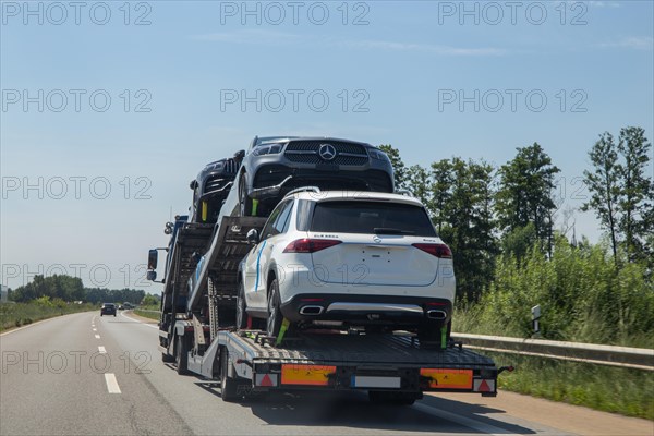 Car transporter with a new Mercedes car travelling on the A 65 (Rhineland-Palatinate)