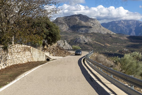 Road to Puerto del Sol pass, Periana, Axarquia, Andalusia, Spain limestone mountains Maroma mountain, Sierra de Tejeda in far distance