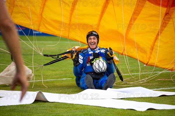 Fistball World Championships from 22 July to 29 July 2023 in Mannheim: Here, former world-class gymnast and passionate skydiver Eberhard Gienger lands with a parachute as part of the opening ceremony in the Rhine-Neckar Stadium