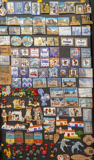 Close up tourist souvenir products on sale including fridge magnets, city of Evora, Alto Alentejo, Portugal, southern Europe, Europe