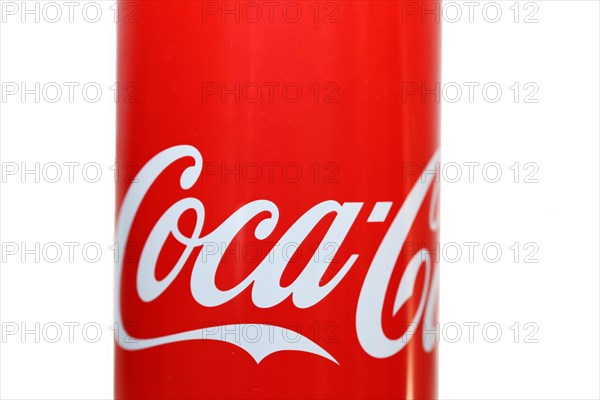 Close-up of a Coca-Cola can against a white background