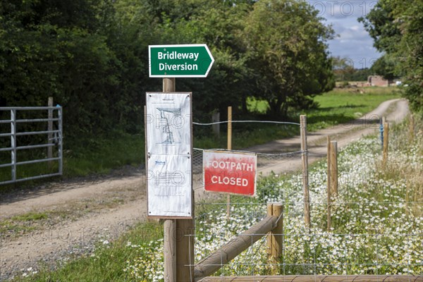 Footpath closed bridleway alternative route diversion signs in countryside at Sutton, Suffolk, England, UK