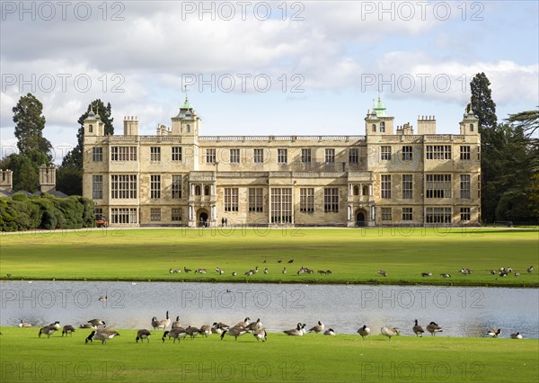 Lawn, geese, River Granta at front of Audley End House and Gardens, Saffron Walden, Essex, England, UK