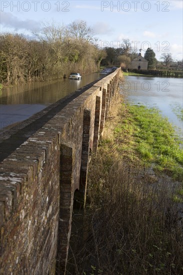 Mini Cooper S car stuck in River Avon flood water, Kellaways bridge, Wiltshire, England, UK 24/12/20
