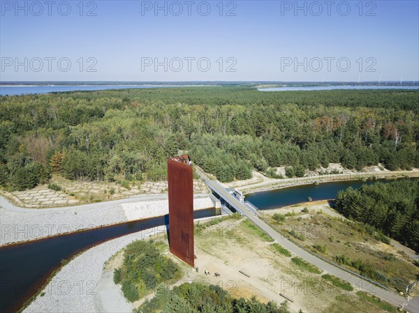 The 30 metre high landmark of the Lusatian Lakeland, the so-called Rusty Nail, was built at the mouth of Lake Sedlitz. It is a lookout tower made of 111 tonnes of Corten steel, with the base of a right-angled triangle with cathetus lengths of approximately twelve and eight metres. 162 steps lead to the viewing platform on the tower, Senftenberg, Brandenburg, Germany, Europe