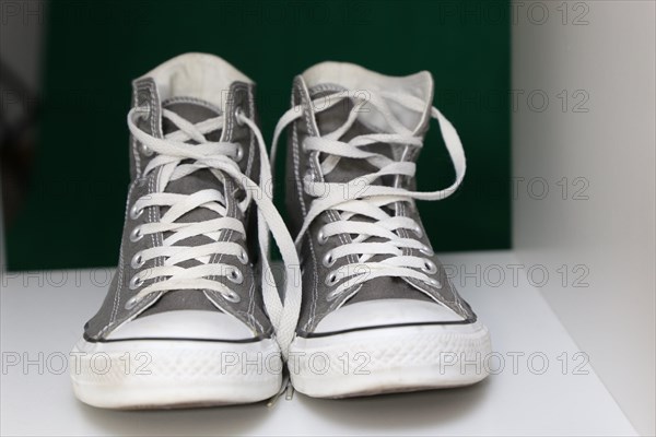 Grey Chucks on a shelf