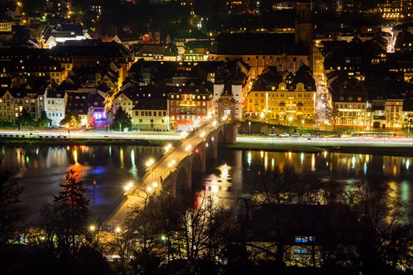 Night shot of Heidelberg's old town. Photographed in December 2022 from a vantage point on Heidelberg's Philosophenweg. The Old Bridge is unlit except for the streetlights