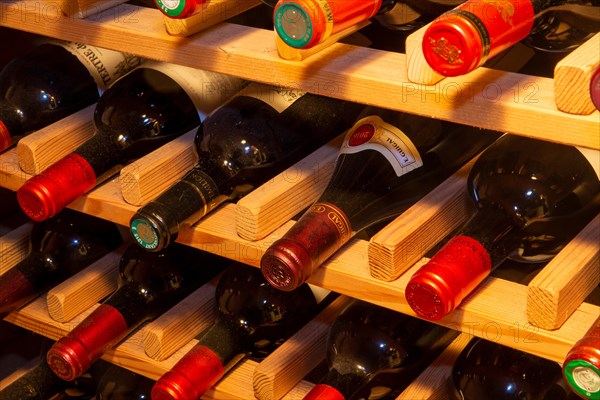 Wine cellar with red wine bottles (editorial)