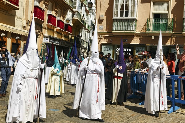 Semana Santa, procession with Nazarenos and tourists, celebrations in Cadiz, Spain, Europe