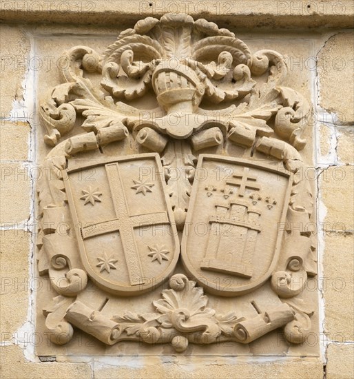 Stonework detail of coat of arms on wall of building, village of Elceigo, Alava, Basque Country, northern Spain