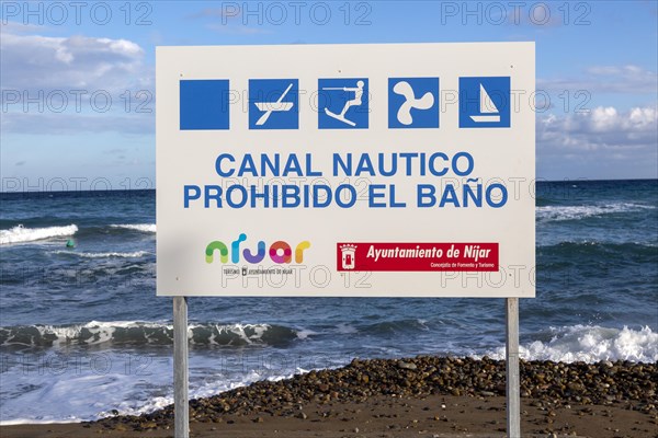 Sign prohibiting bathing swimming in boat channel, Las Negras, Cabo de Gata Natural Park, Nijar, Almeria, Spain, Europe