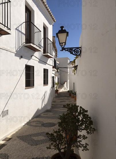 Traditional pueblo blanco narrow streets whitewashed houses, village of Frigiliana, Axarquia, Andalusia, Spain, Europe