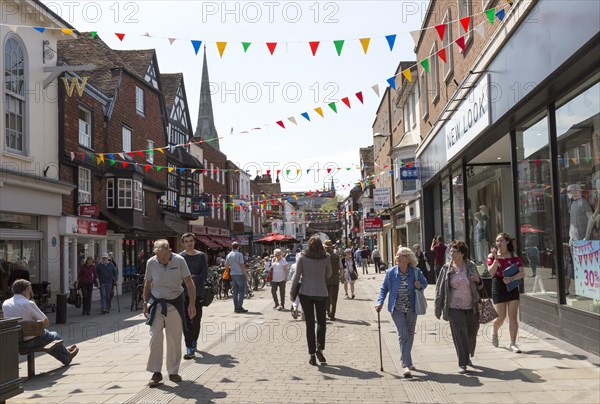 Busy pedestrianised shopping street in town centre, High Street, Salisbury, Wiltshire, England, UK