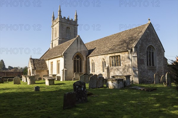 Graves in the graveyard of the village parish church of Saint James the Greater, Dauntsey, Wiltshire, England, UK