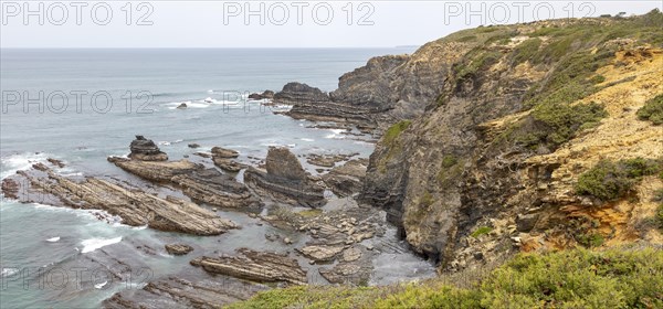 Rocky rugged coastline near fishing port village of Azenha do Mar, Alentejo Littoral, Portugal, southern Europe, Europe