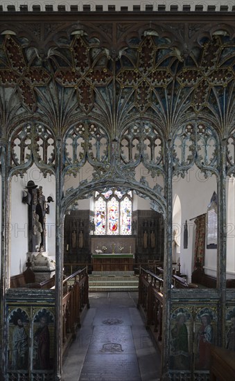 Elaborately decorated wooden rood screen in church of Saint Andrew, Bramfield, Suffolk, England, UK