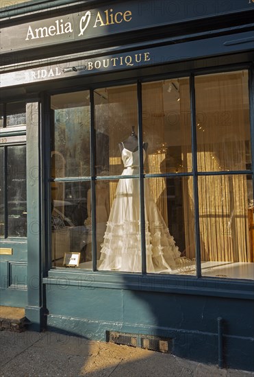 Wedding dress in shop window Amelia and Alci bridal boutique shop, Market Hill, Woodbridge, Suffolk, England, UK