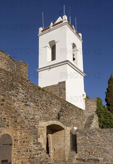 Whitewashed tower and gateway to historic walled hilltop village of Monsaraz, Alto Alentejo, Portugal, southern Europe, Europe