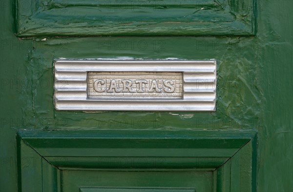 Close up of traditional style letterbox on front door of house in Evora, Alto Alentejo, Portugal, Europe