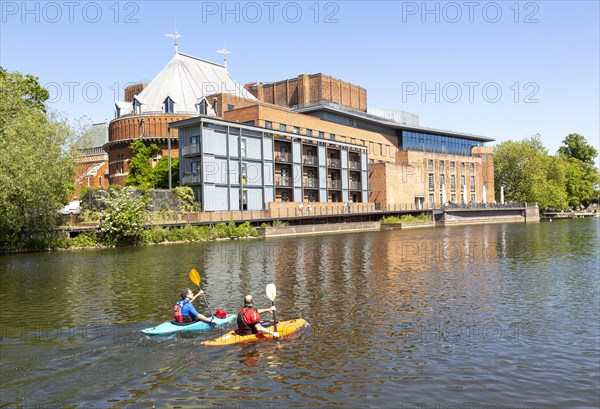 Royal Shakespeare Company theatre and canoeists on the River Avon, Stratford-upon-Avon, Warwickshire, England, UK