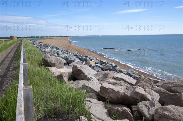 Shingle bay bar and lagoon landforms with rock armour coastal defences at Bawdsey, Suffolk, England, UK