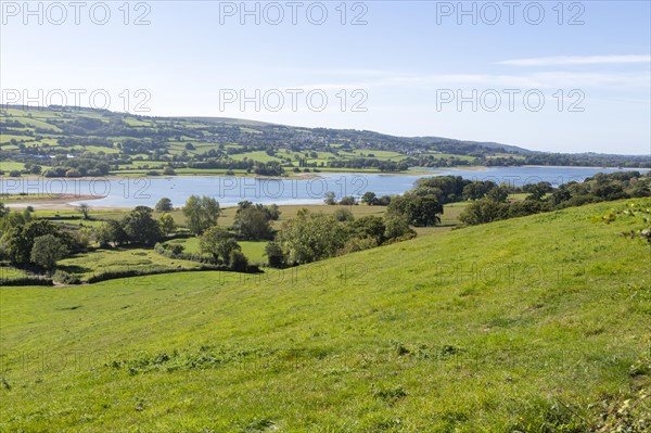 View over Blagdon Water reservoir lake to Mendips from Nempnett Thrubwell, Somerset, England, UK