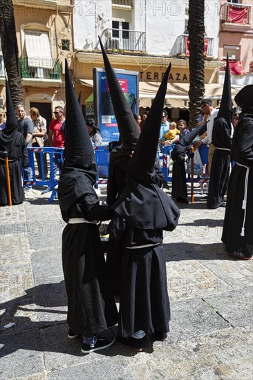 Semana Santa, procession with Nazarenos and tourists, celebrations in Cadiz, Spain, Europe