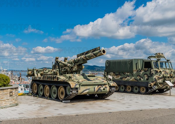 SeosanEight inch self-propelled gun beside M548 tracked cargo carrier on display at seaside park in Seosan, South Korea, Asia