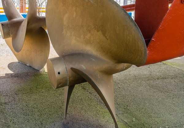 Closeup of large metal propeller on retired frigate on display at public park in Seosan, South Korea, Asia