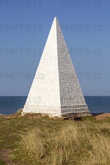 Emmanuel Head white pyramidal navigation beacon, Holy Island, Northumberland, England, UK built 1801-10 by Trinity House