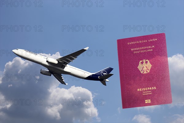 Symbolic image: Lufthansa passenger aircraft taking off, in the background a passport of the Federal Republic of Germany