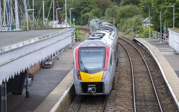 British Rail Class 755 Stadler bi-modal train leaving railway station at Woodbridge, Suffolk, England, UK destination Ipswich