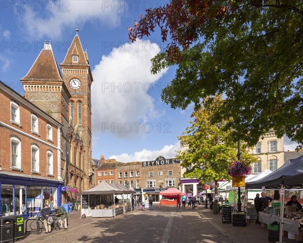 Clock tower of town hall and historic buildings in Market Place, Newbury, Berkshire, England, UK