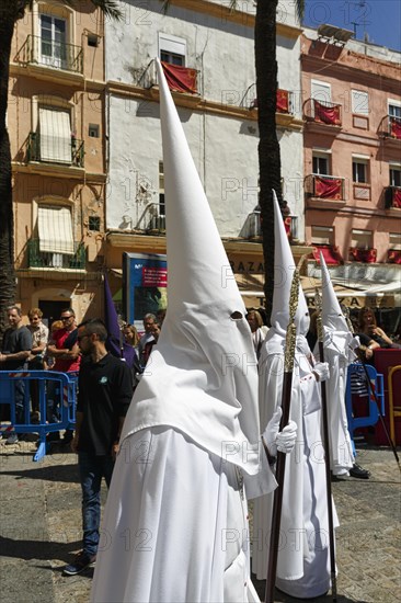 Semana Santa, procession with Nazarenos and tourists, celebrations in Cadiz, Spain, Europe